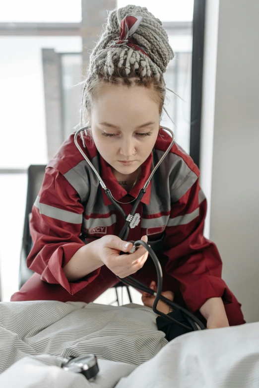 a female doctor is checking the  of a patient