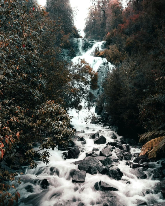 the small stream is going up the side of the mountain