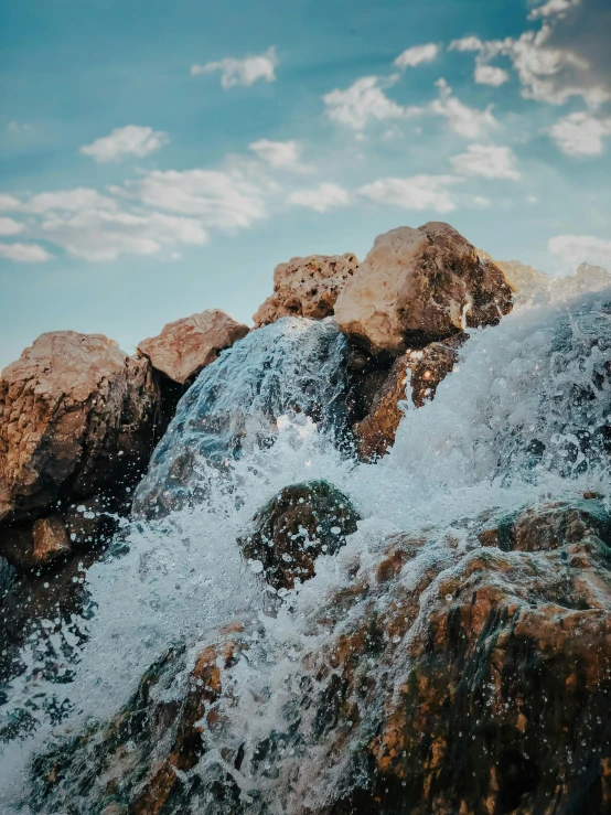 water and rocks crashing onto one another