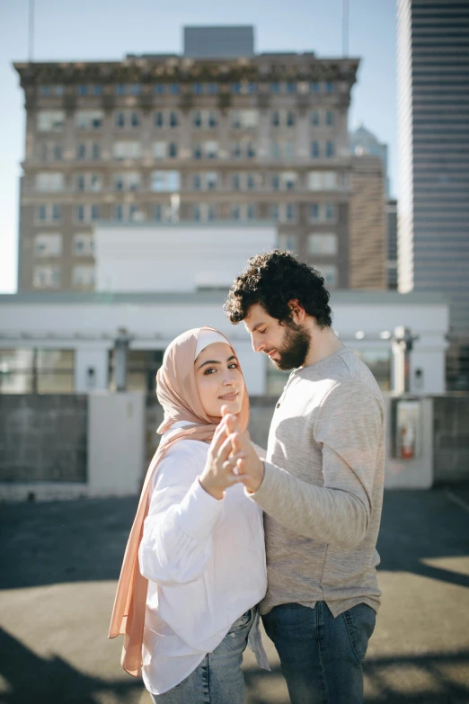 a man and a woman holding each other