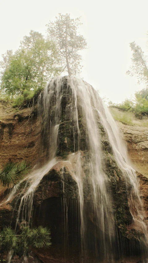 an image of a waterfall that is in the air