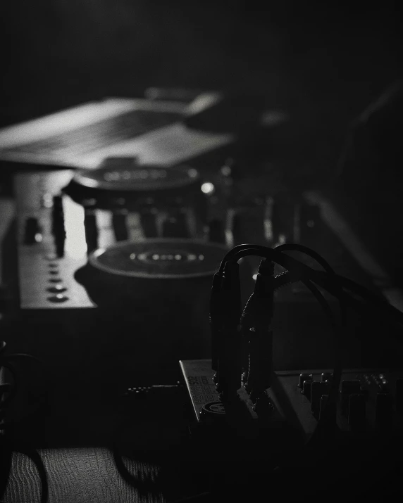 black and white pograph of interior with dj equipment