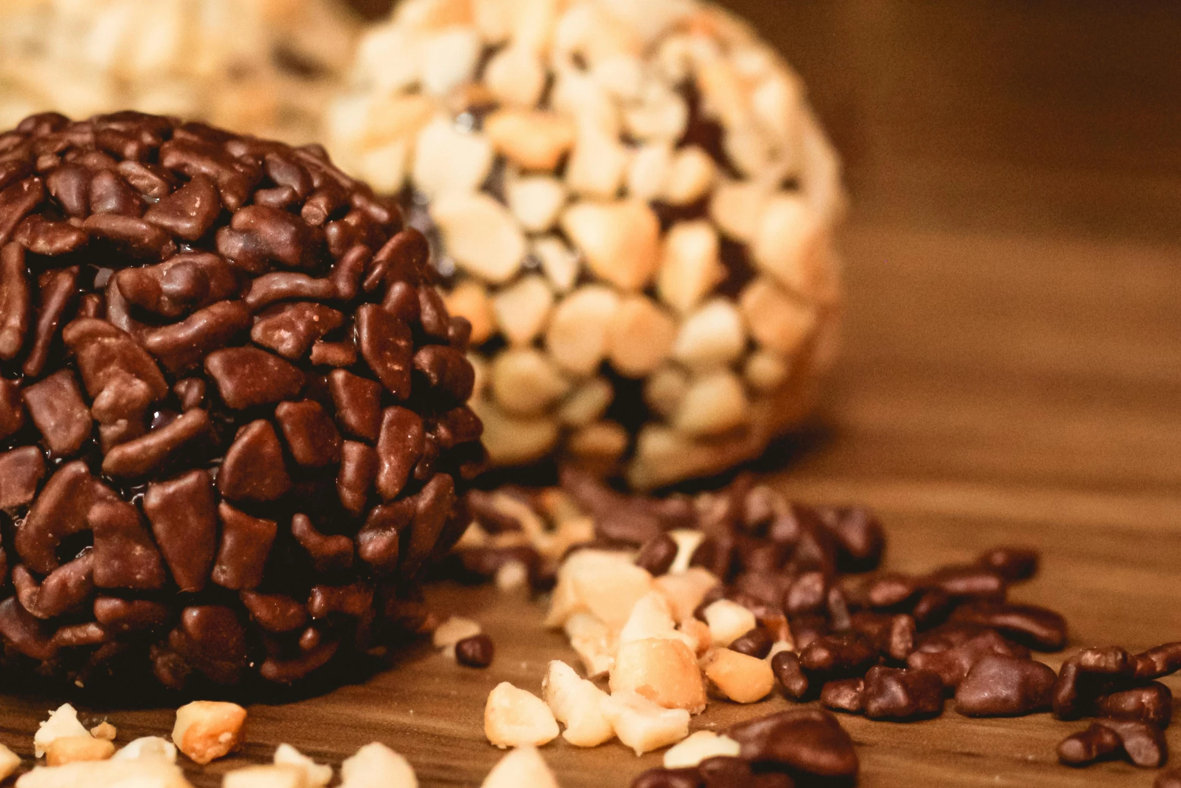 a close up of a chocolate and peanuts on a table