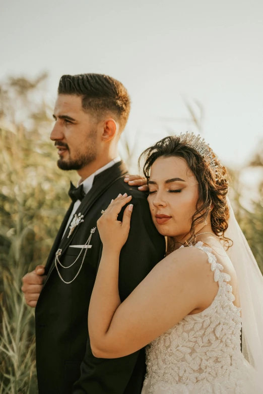 a newly married couple emce each other at their wedding