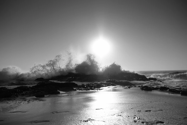 a person walking through some water near the shore