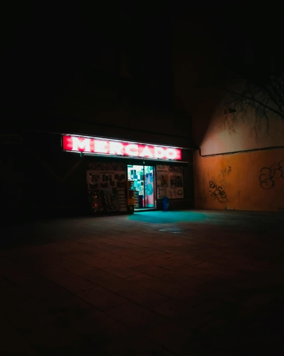 dark scene showing neon sign in the doorway