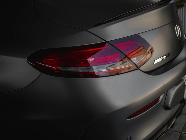 a close up view of a car with the tail lights on