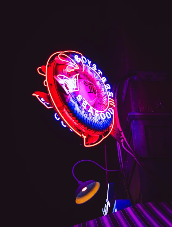 a neon sign on the side of a building