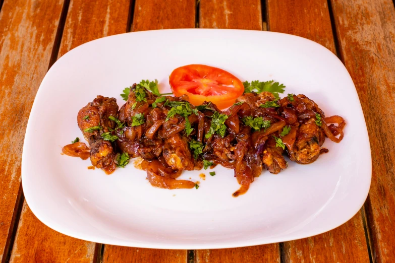 a plate of food sitting on top of a wooden table