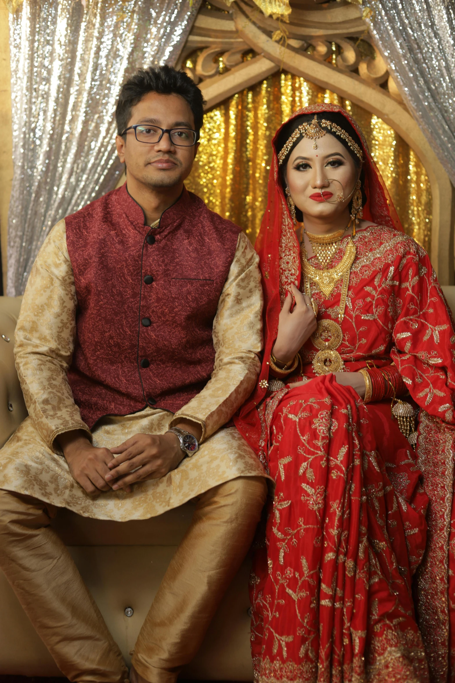 a man and woman are posed on a couch