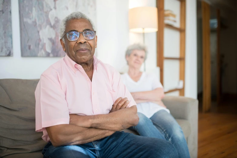 a man and woman are sitting on a couch