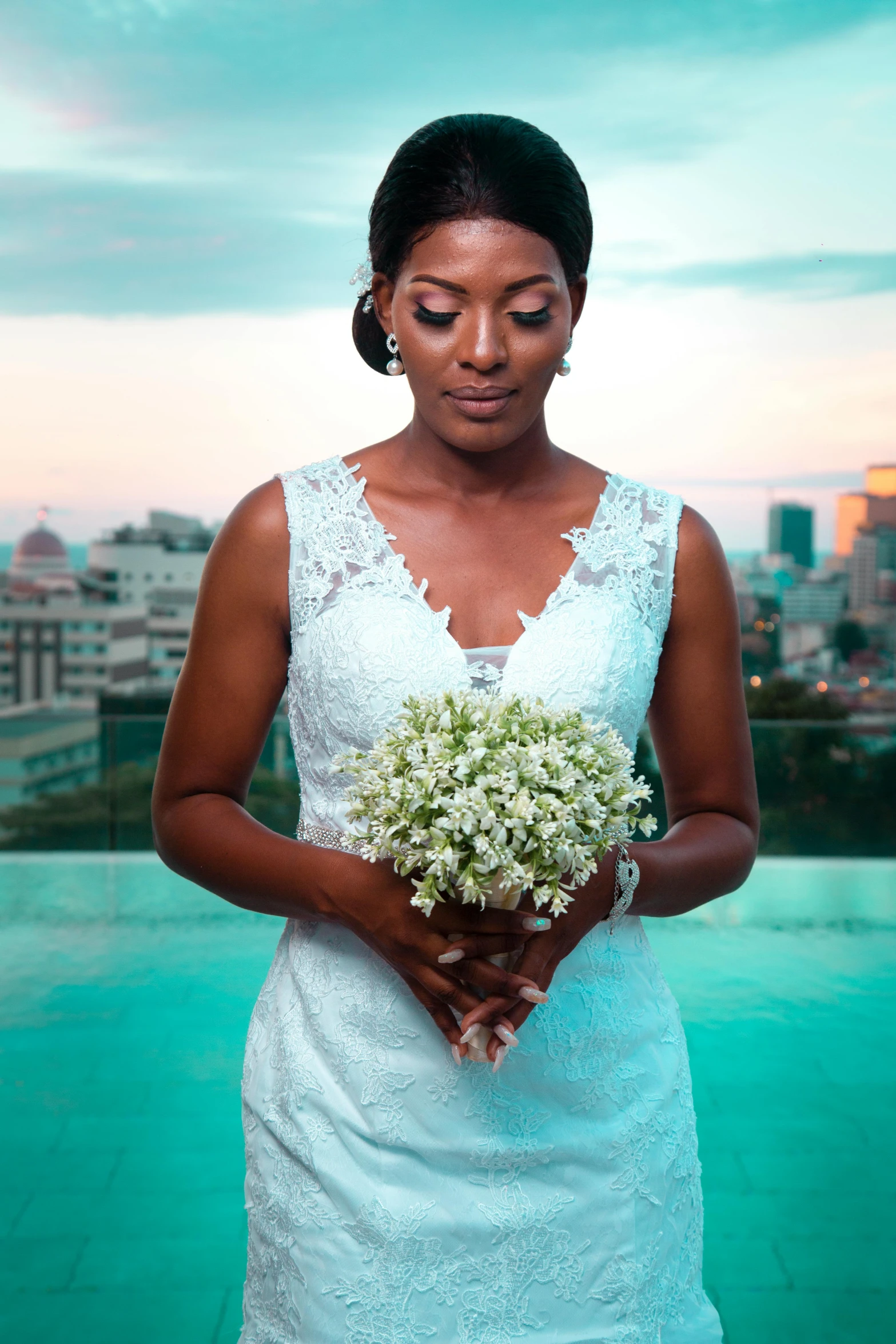 a woman in a wedding dress holding a bouquet