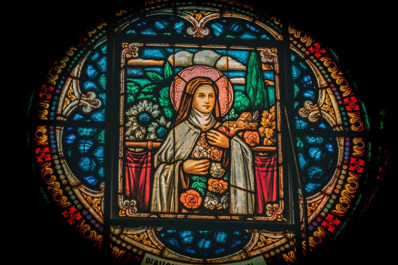 a colorful stained glass picture of a woman