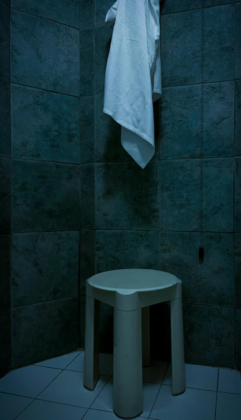 a towel hanging from a clothes line in a dark room