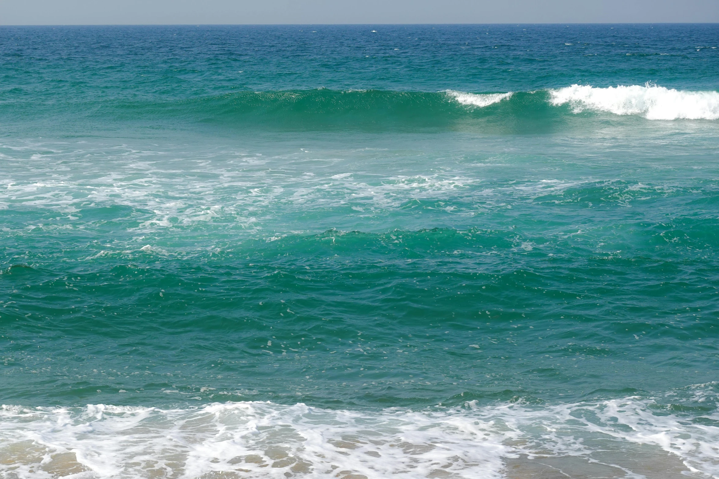 a surf board is sitting in the ocean