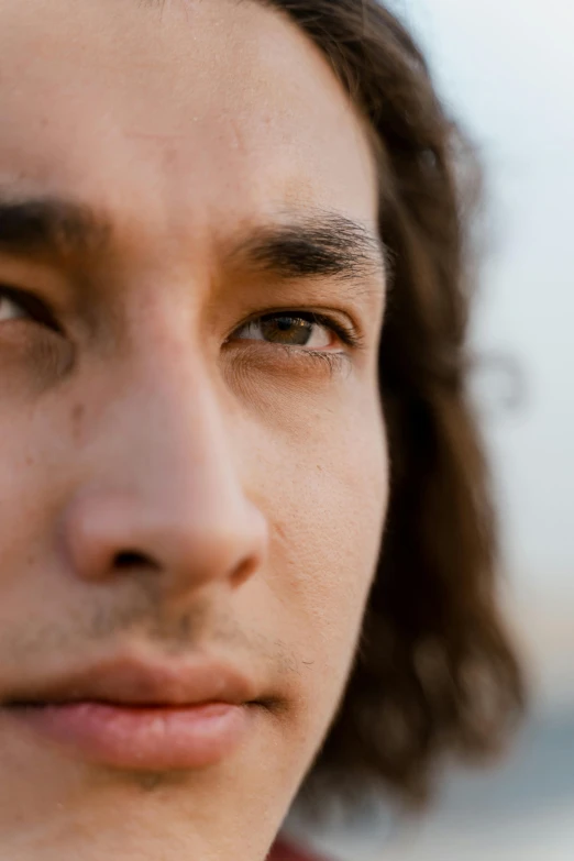 a close up s of a person wearing a suit and tie