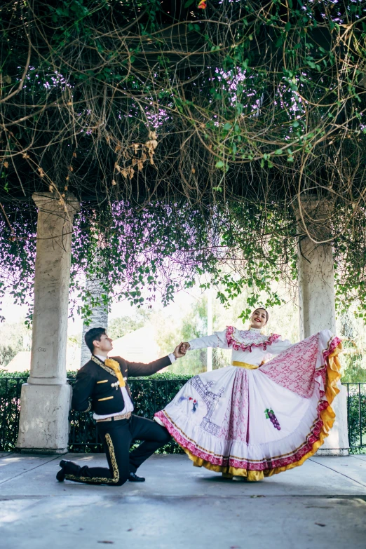 a man and woman that are dressed up in old time clothing