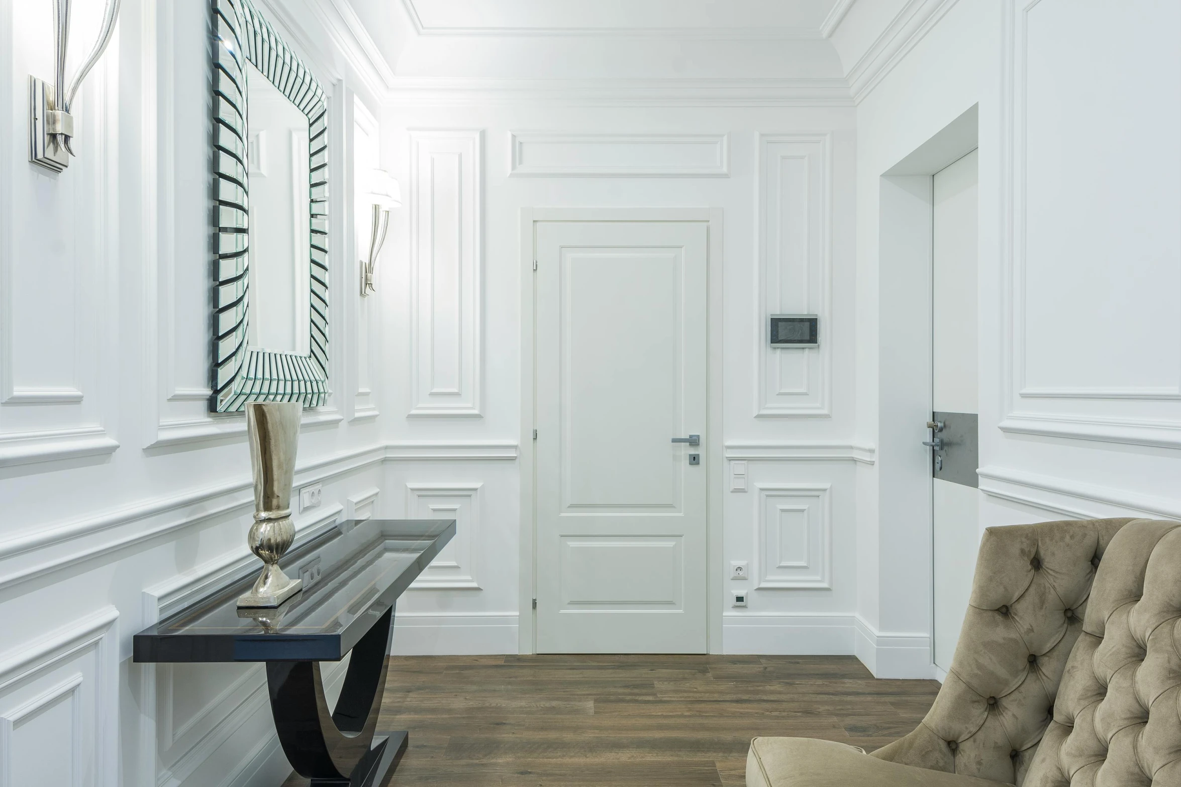 a modern wooden bench next to a white door