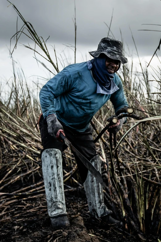 a person walking on a grassy area with a shovel