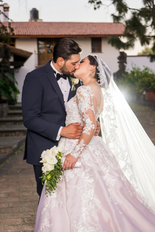 a bride and groom are posing for a wedding po