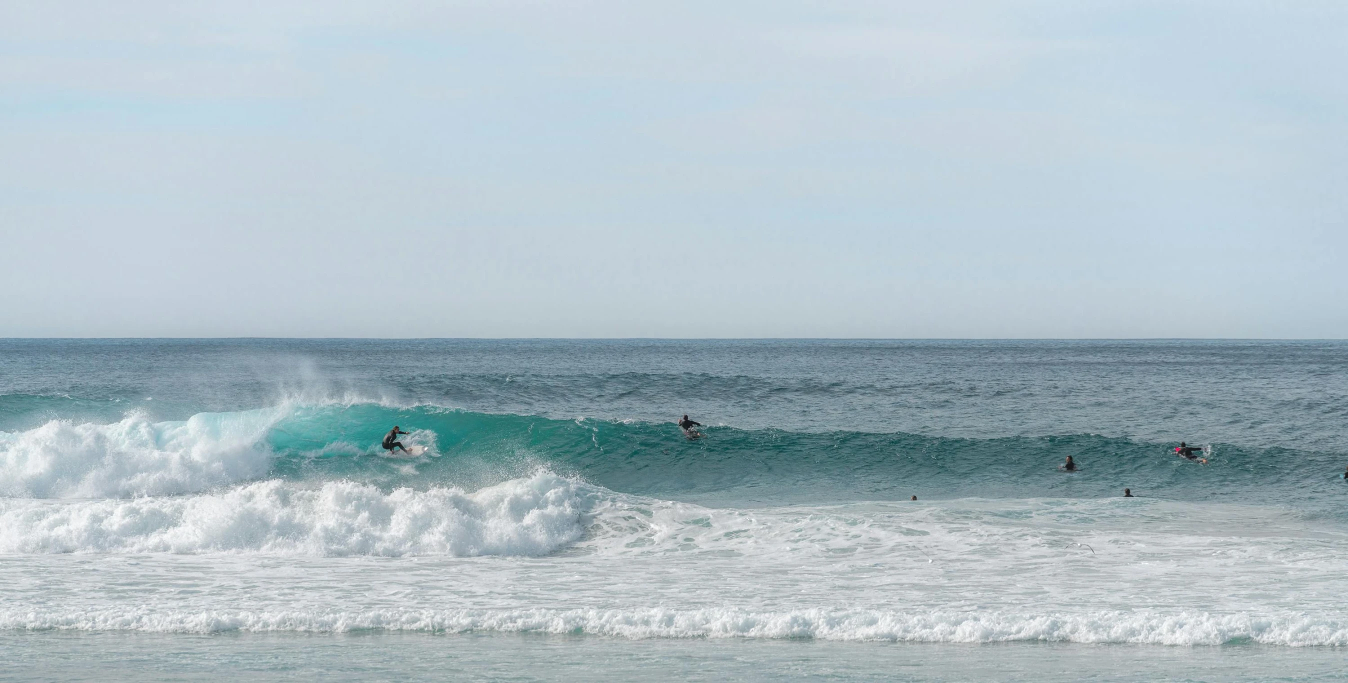 the surfers are enjoying their wave in the ocean