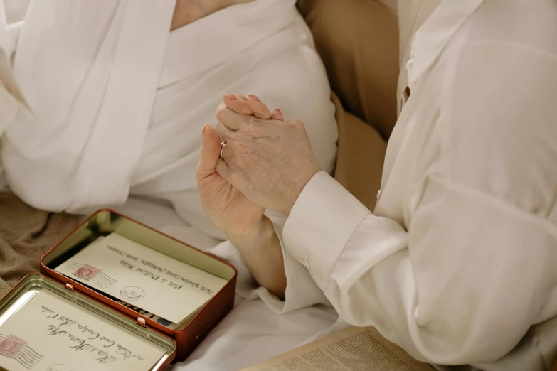 a close up of two people laying in bed together