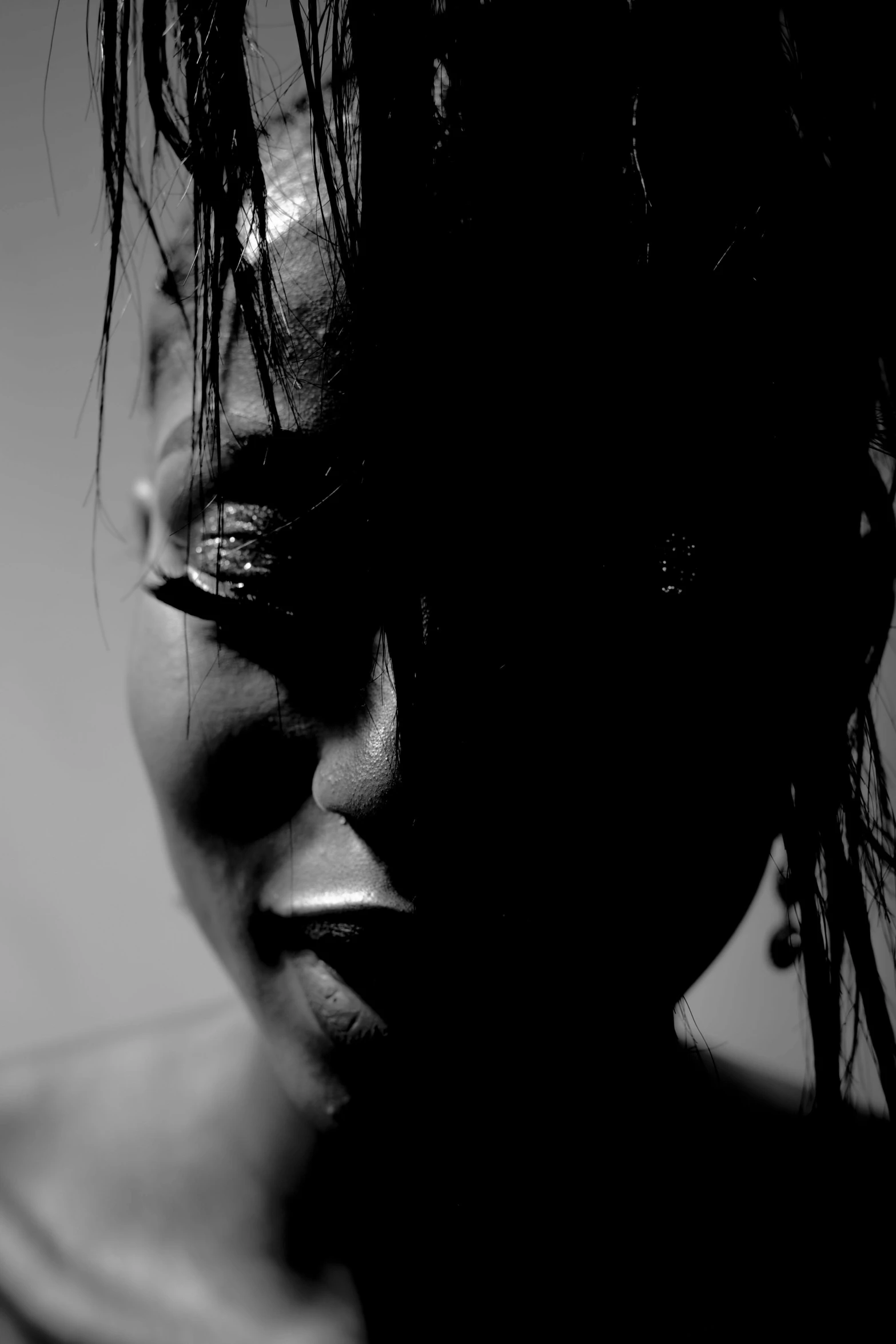 black and white po of a woman with water coming out of her face