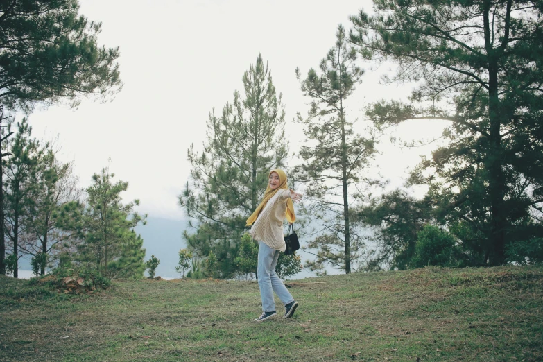 a woman holding a frisbee in her hand