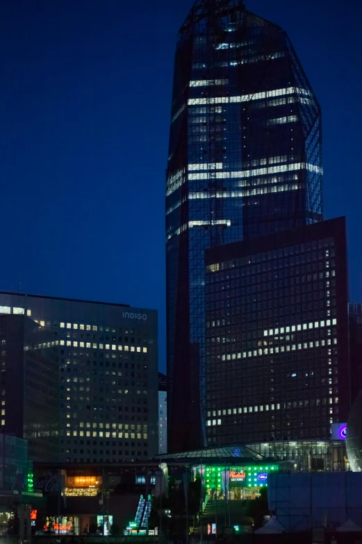 a tall building is lit up at night