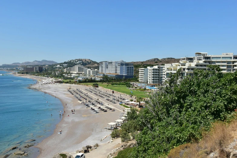 a beach with a bunch of cars parked in it