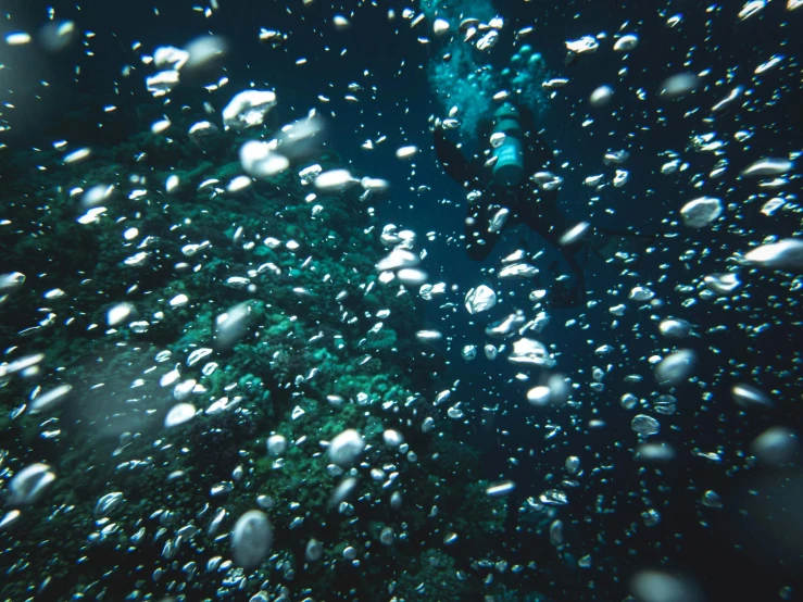 some rain drops on the window of a bus