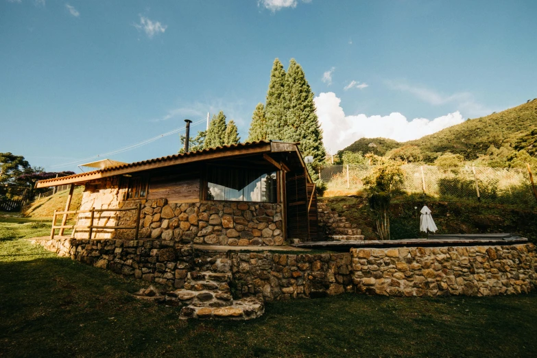 a house that has a rock wall under it