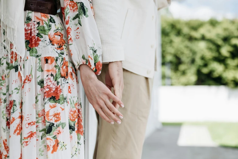 an image of an adult holding the hand of a child