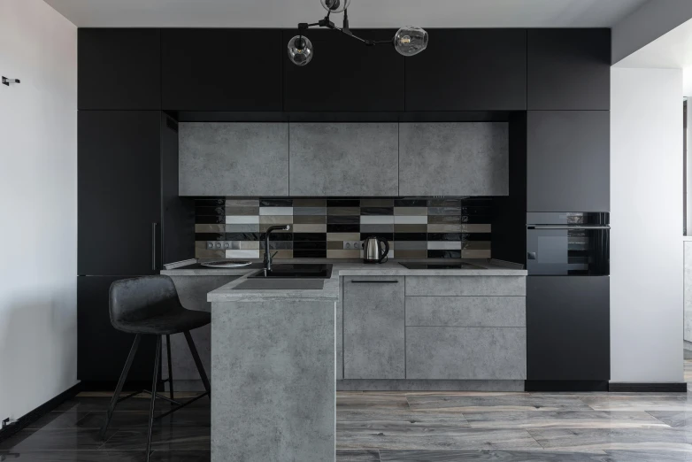 the view of a kitchen from across the room, including stools and bar