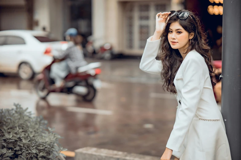 a beautiful young woman posing for a picture