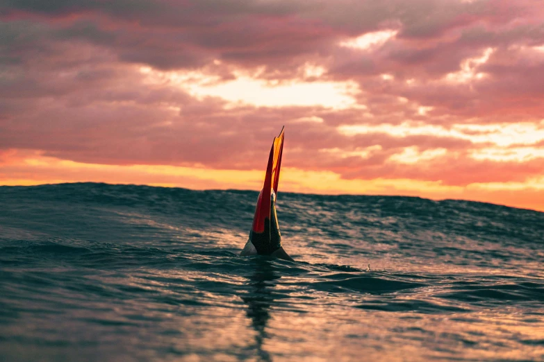 a sailboat in the middle of an ocean