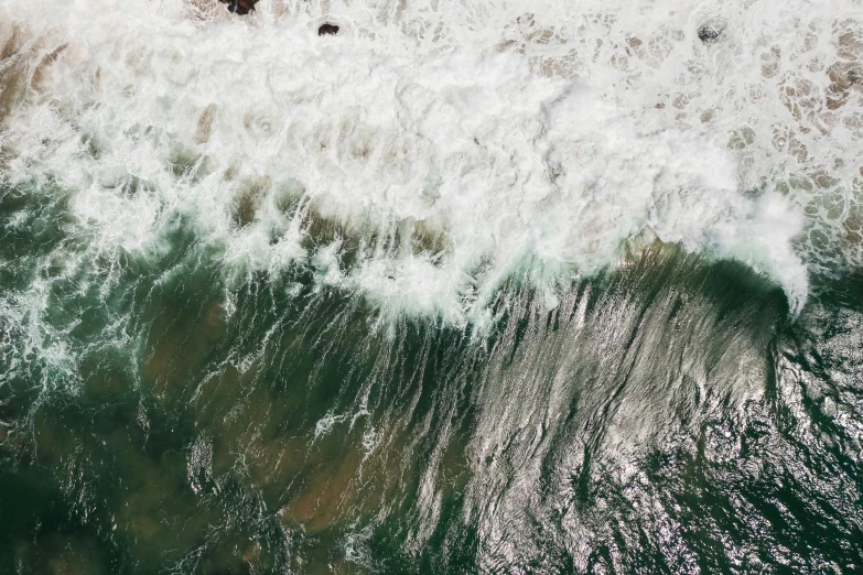 a surfer riding the waves on his surfboard