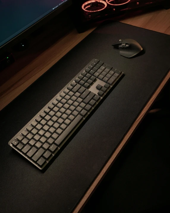 a keyboard and a mouse sitting on a table