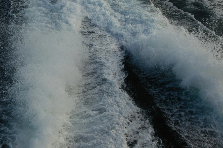 a jetboat in the middle of a choppy water wake