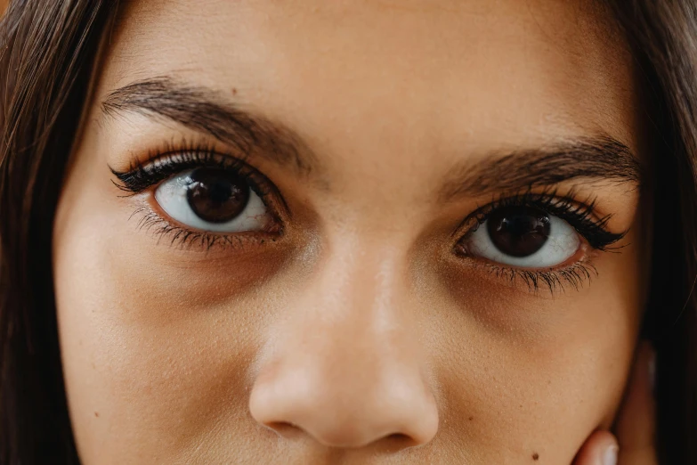 a closeup s of a woman's face and eye