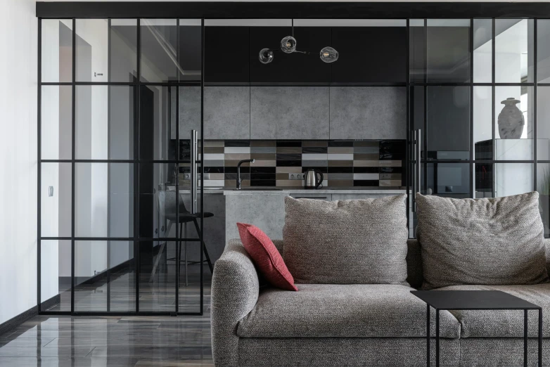 a modern living room with a gray and red couch