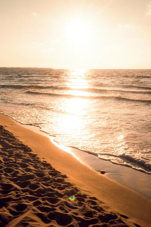 the sun is shining bright at the beach