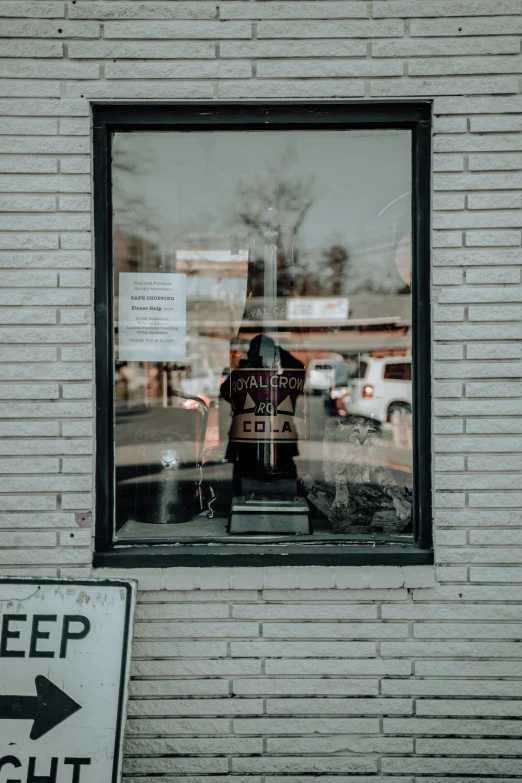 window and sign on building of business in urban setting