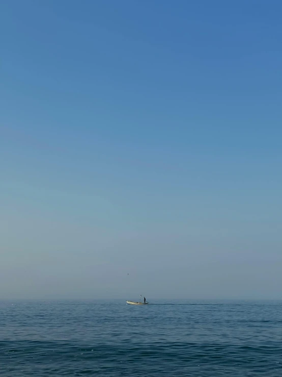 an airplane flying over the ocean with no one on board