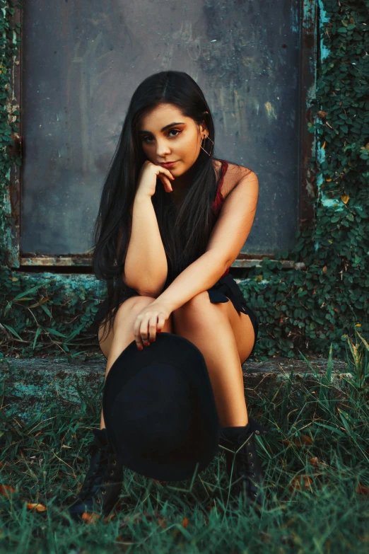 an image of a girl with long hair sitting down