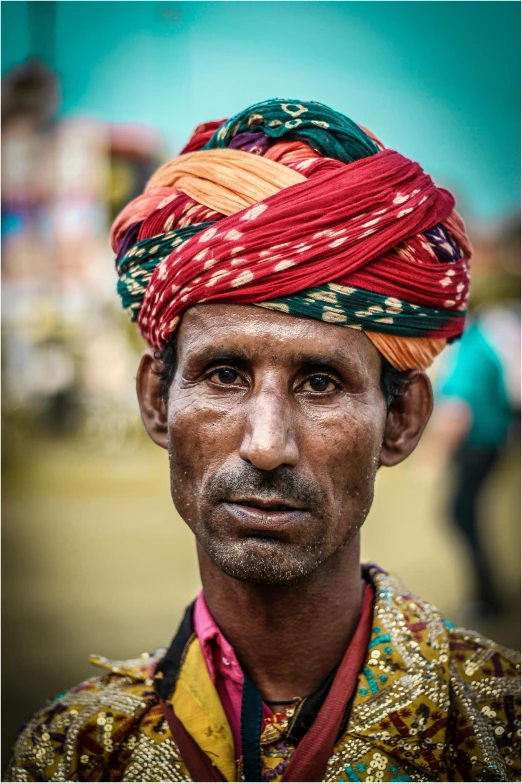 this is an indian man with many colorful hats