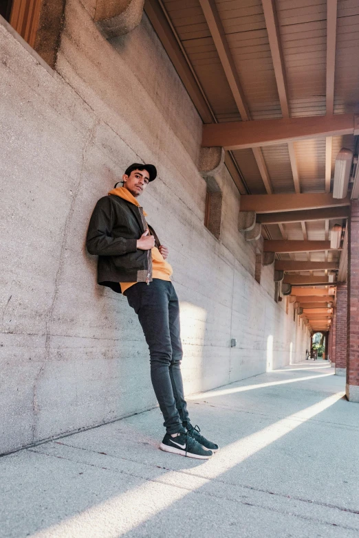 a person leaning on a concrete wall