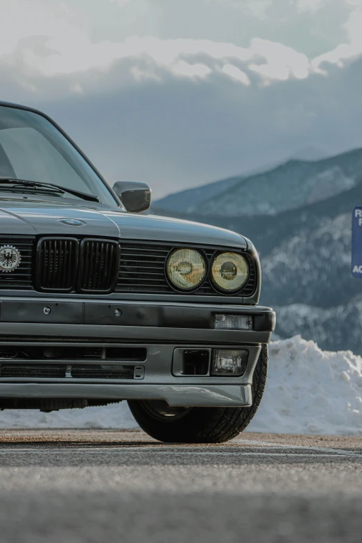 a car that is parked on a snowy road