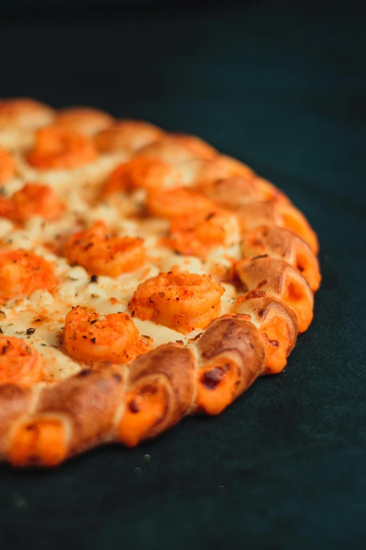 a cooked pizza sits on top of a surface