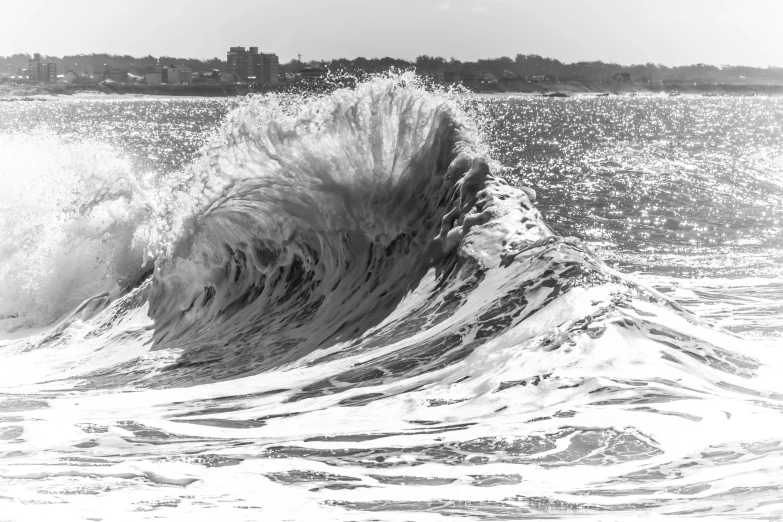 a big wave in the middle of a beach